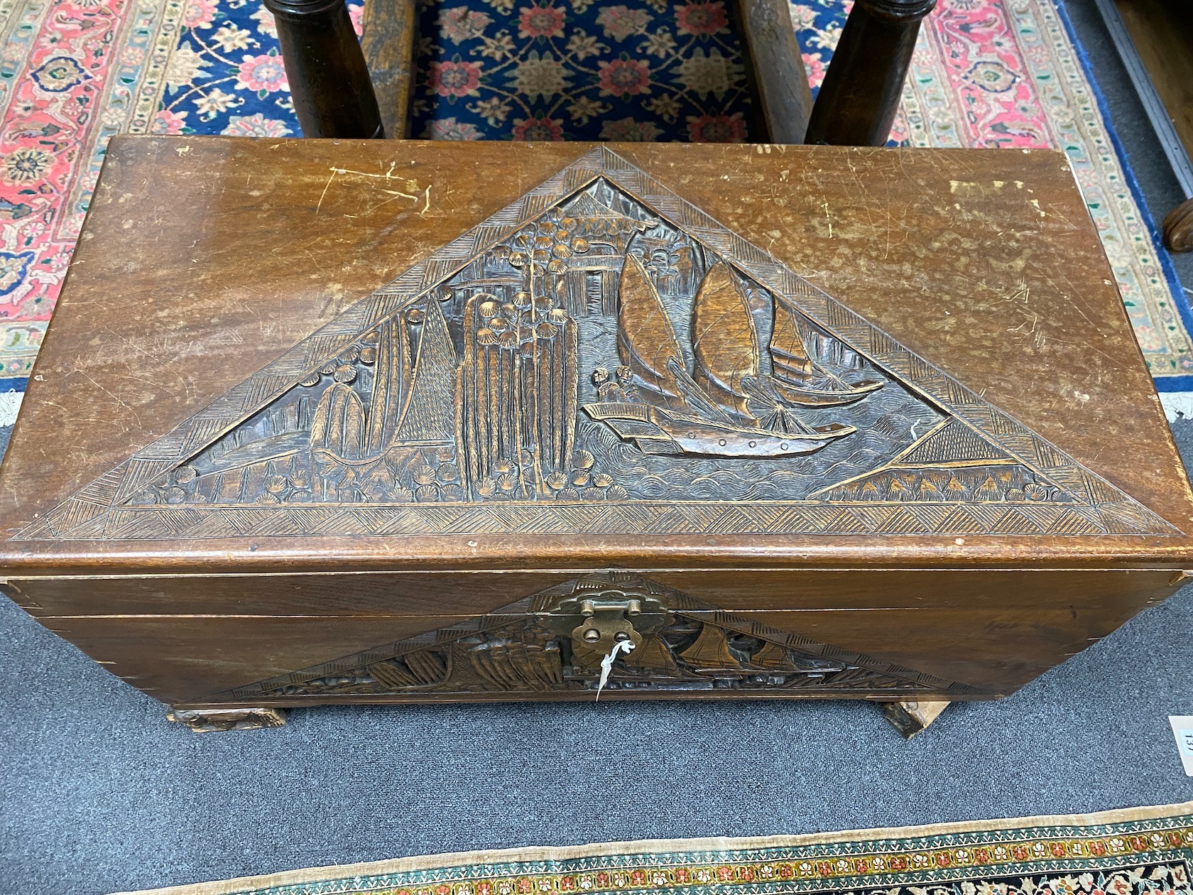 A Chinese carved camphorwood coffer and similar smaller box, larger length 93cm, depth 44cm, height 49cm